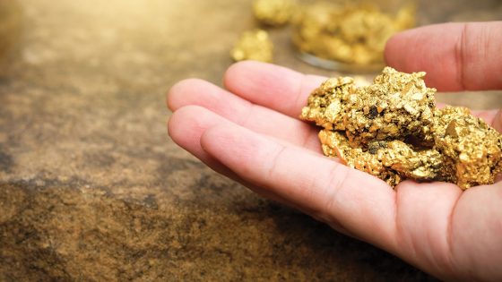 Hand with gold nugget 1200x675 1