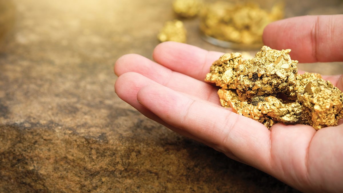 Hand with gold nugget 1200x675 1